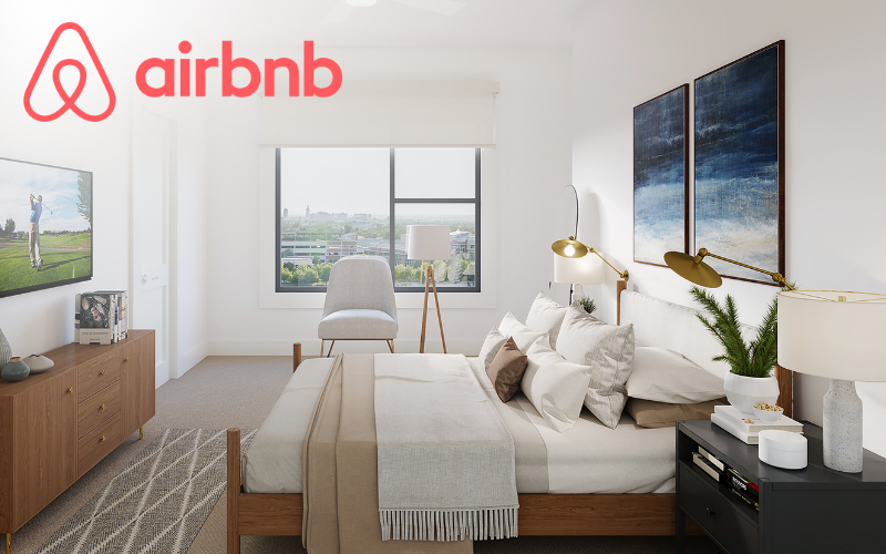bedroom with bed tv windows and an airbnb logo